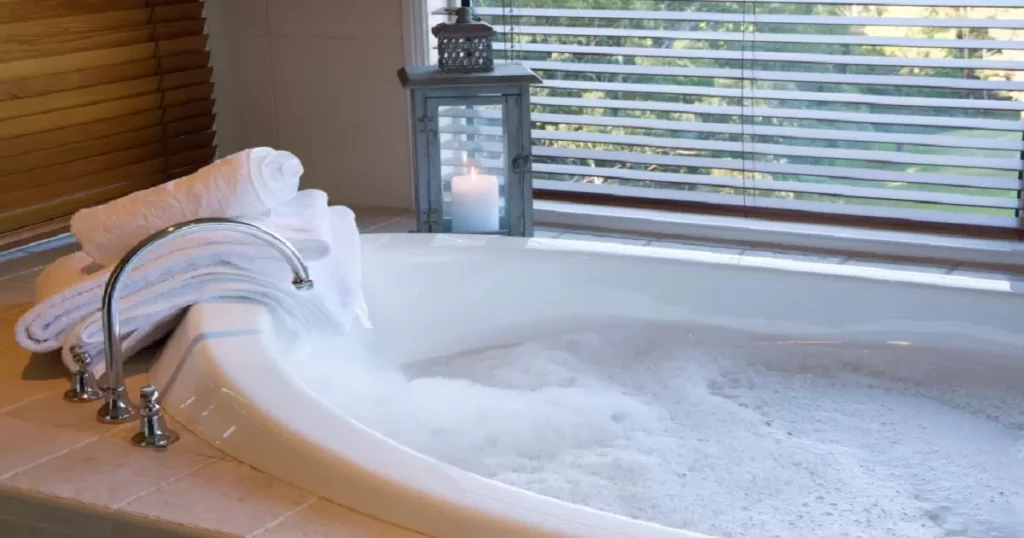 How can bath bombs damage jetted tubs and hot tubs?
